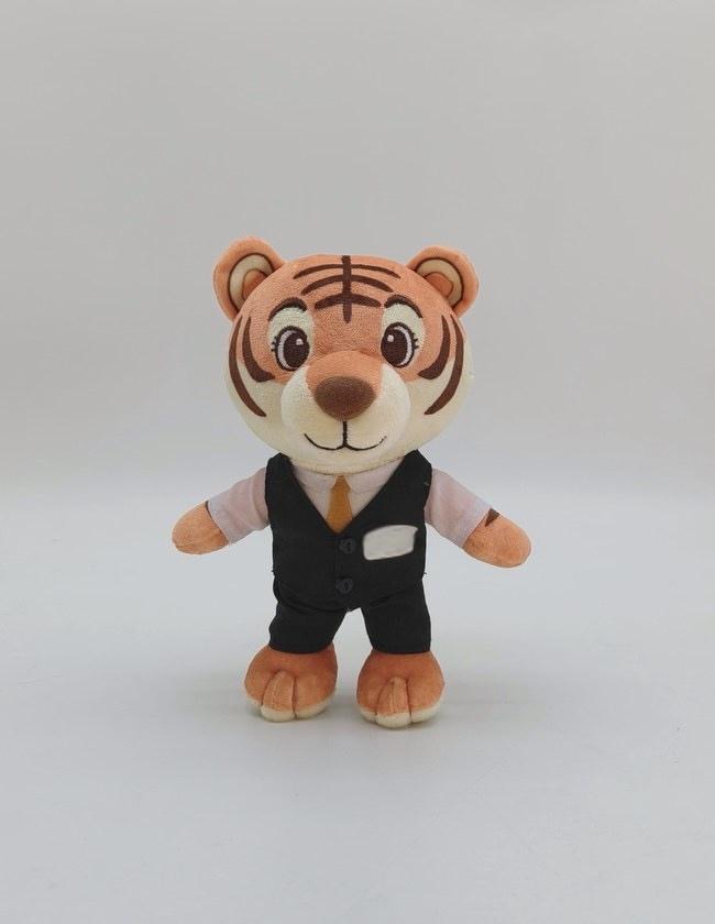 Approved pre-production sample of the tiger mascot plush in a tailored vest