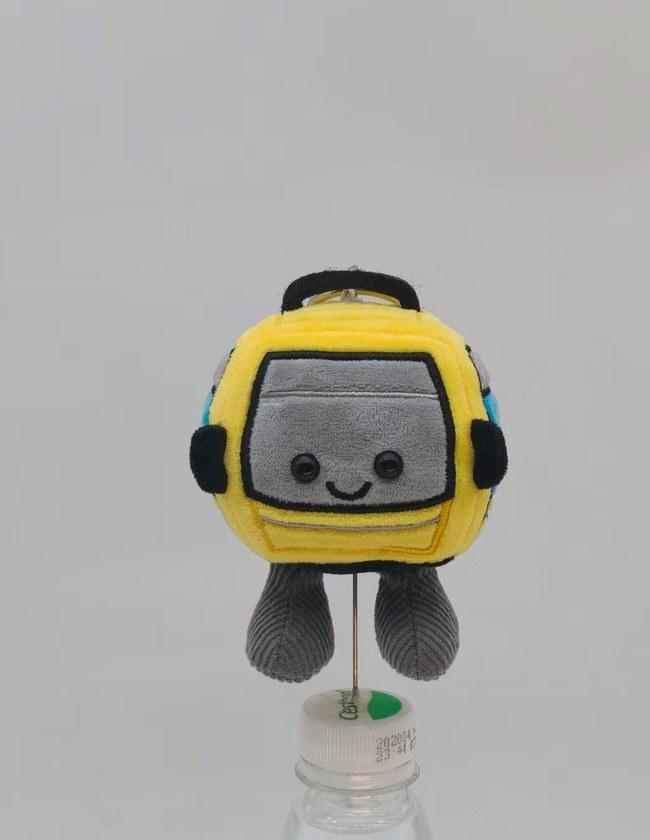 Approved pre-production sample of the cable-car plush keychain charm