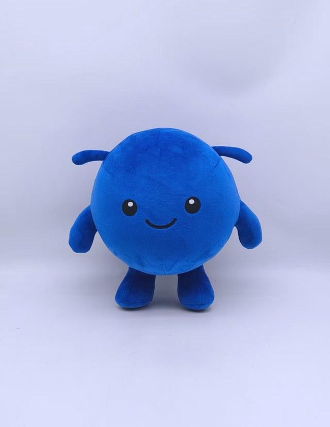 Approved pre-production sample of the rounded blue character soft toy, front view
